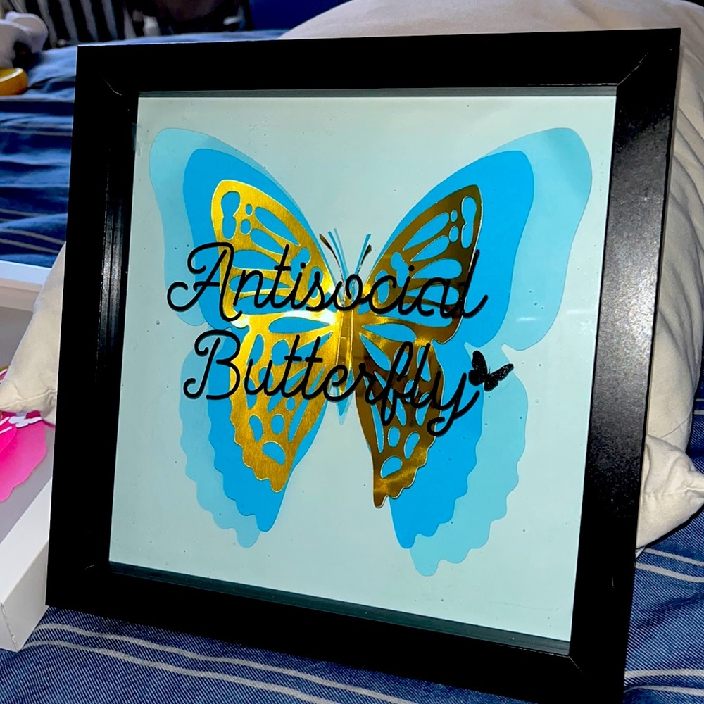 Handcrafted 8inx8in shadowbox.Antisocial Butterfly on blue&gold with black frame